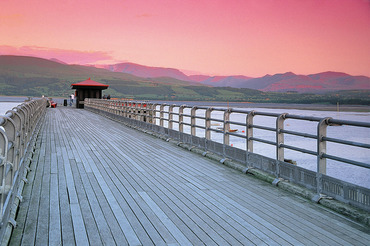 Beaumaris Pier and Snowdonia at sunset